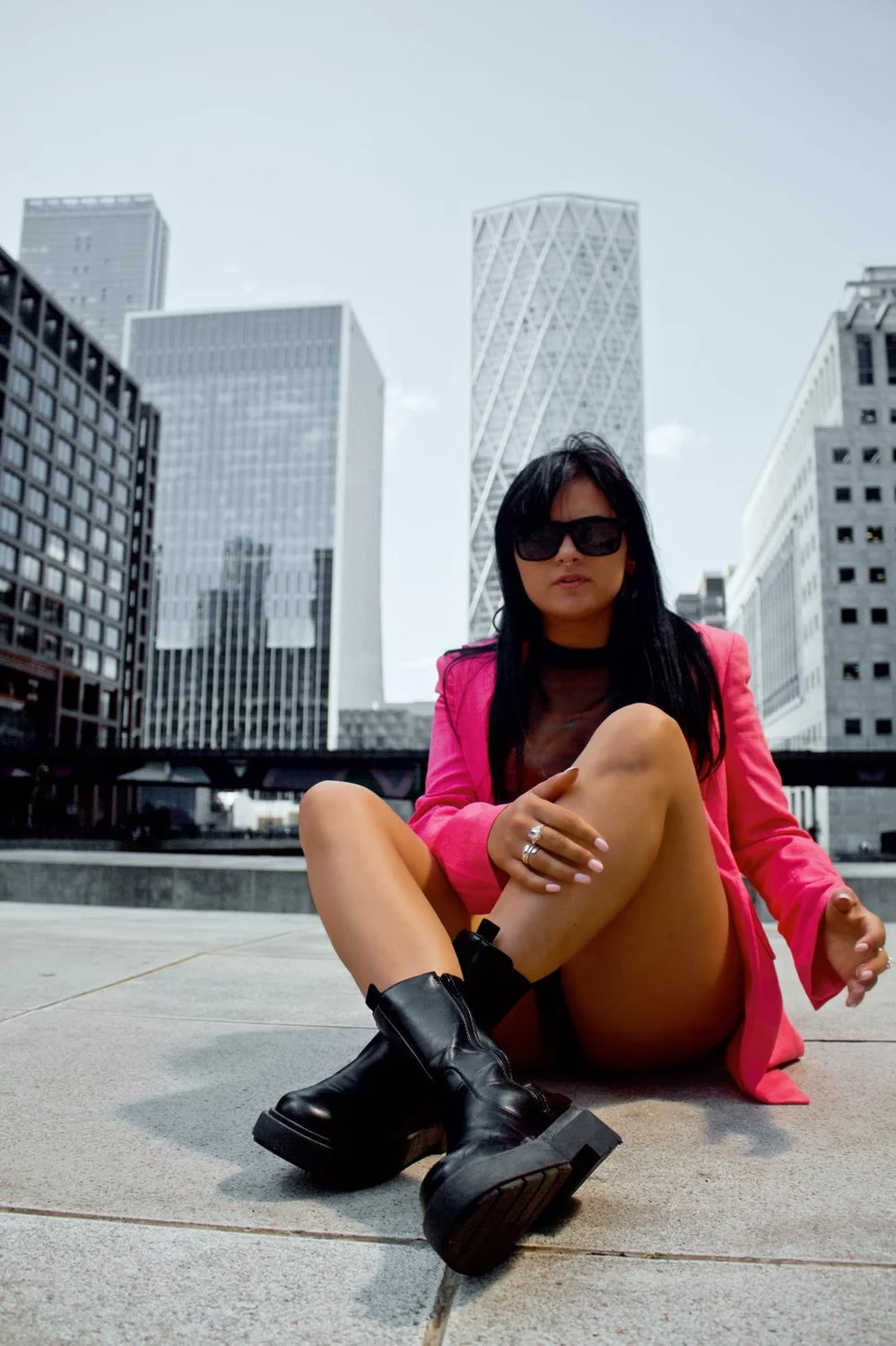 Andreea in a pink blazer in the city